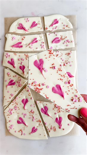 Stephanie Niemis on Instagram: "You only need 2 ingredients to make this Valentine’s Day Bark! It’s such a fun treat and would make a great homemade gift! Comment “recipe” and I’ll send you the printable recipe 💗. ⭐️ Follow for more simple, festive recipes ⭐️ Valentine’s Day Bark 💗 Pour melted white chocolate on a small cookie sheet lined with parchment paper. (I used 1 cup and didn’t go all the way to the edges) 💗 Mix 2 tbsp of white chocolate with natural red dye. Use a small spoon to place