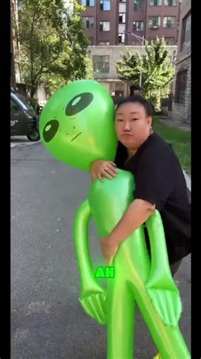 👽🎈😠 Don't even think about stealing my alien balloon! #funny