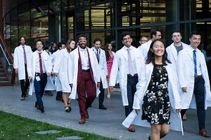 Getting their white coats (and, for one student, getting engaged): A big day for Stanford's newest med students
