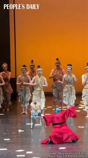 At the curtain call of a dance drama in Beijing, two homegrown humanoid robots wowed the audience with a fantastic display of motion — performing backflips and Chinese Kung Fu moves with remarkable agility. | People's Daily, China