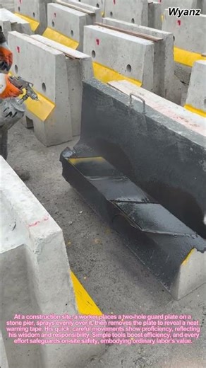 Worker Spraying Warning Tape on Stone Pier with Perforated Guard Plate