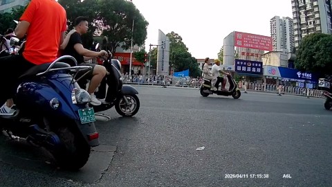 Car crashes into motorcycle at pedestrian crossing in Nanning, Guangxi, China