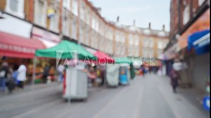 Scene of popular street market in Brixton, London, out of focus Stock Video