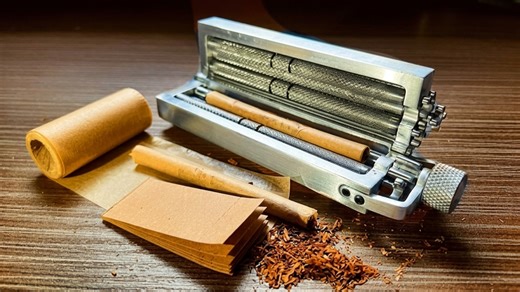 He got tired of rolling cigarettes - so he built a machine to do it