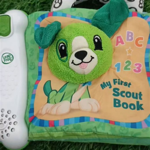 preloved funtastic toys! on Instagram: "LeapFrog My First Scout Book An interactive soft book designed for babies and toddlers. This educational toy aims to introduce early learning concepts through engaging activities. Learning Focus: It introduces numbers (1-10), letters (A-Z), colors, and shapes through interactive pages featuring Scout (or Violet in a similar version). Interactive Features: The book includes touch-and-feel elements like a shiny pond, crinkly flower, peek-a-boo flap, and baby