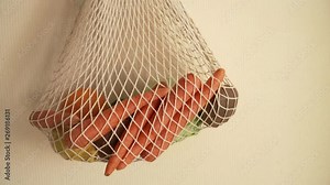 Recycling mesh string bag full of vegetables and fruits, eco frindly no plastic concept 4k