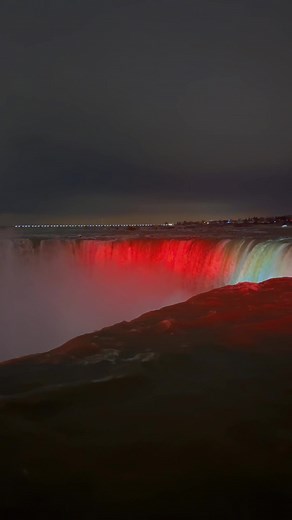Majestic Waterfall Illuminated at Night