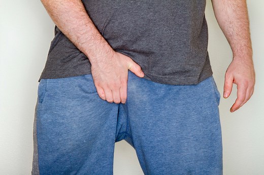 Why Men Touch Their Crotch So Much, According to Experts