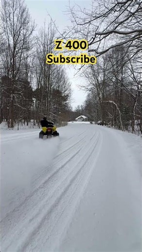 Suzuki ltz 400 in snow. Big drift.