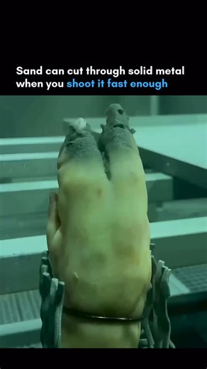AI | Innovation | Robotics on Instagram: "We think of sand as soft and harmless but accelerate it to a few hundred miles per hour and suddenly it cuts through iron like butter. This is industrial sandblasting that strips rust, removes paint, and goes straight through metal if you’re not careful. The video shows a sandblaster piercing iron completely because velocity changes everything. A grain of sand at rest is harmless but a grain of sand at 700 mph becomes a tiny bullet. It’s the same princip