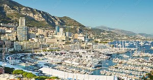 Monaco, Monte-Carlo, 27.09.2016: Timelapse of first day MYS Monaco Yacht Show, Port Hercules, luxury megayachts, big boat, view from Princes Palace of Monaco, sunset, aerial view, 4k video