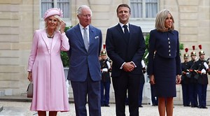 Brigitte Macron Dons Nautical-inspired Skirt Suit to Meet Queen Camilla in Pink Fiona Clare Dress at Élysée Palace in Paris