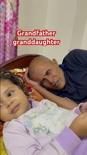 Grandfather granddaughter playing something