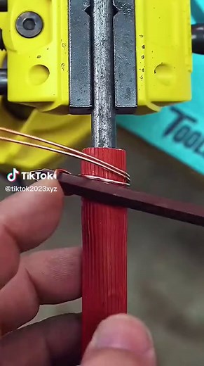Threading and Securing Wire in a Yellow Vise