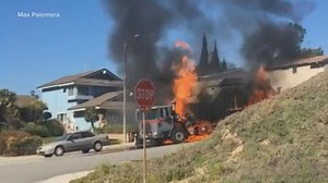 Garbage truck engulfed in flames, barrels downhill outside Los Angeles