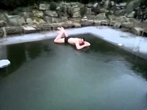 German guy jumps onto frozen pool