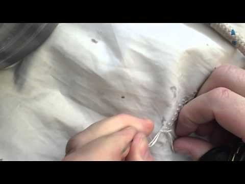 Hand Sewing a small tear in a Sail.