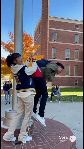 Asian college girl gives guy a flagpole wedgie