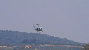 Italian police flying two blade helicopter Agusta Bell AB-212 in rescue acton
