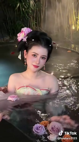 Stunning Poolside Beauty in Ancient Costume