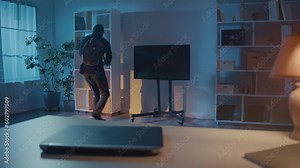 Two Robbers Broke Into an Apartment or House. A Criminals in the Night with a Flashlight and Gun Looking for Jewelry and Money in the Apartment. High-Definition Cameras. Hidden Surveillance Cameras