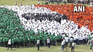 #WATCH | Guinness World Record for the largest human image of a waving national flag achieved by Chandigarh University and NID Foundation at Chandigarh today. Union Minister Meenakashi Lekhi was also present here on the occasion. For more videos, click here https://www.dnaindia.com/videos | DNA India