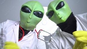 Aliens robbed someone to conduct experiments on them, torture and implant microchip. Humanoids clap their hands because operation was success. View through eyes of victim.