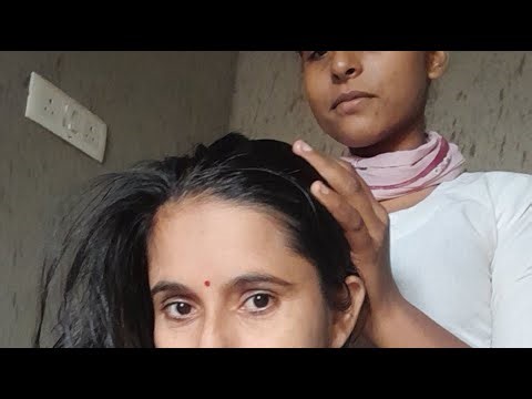 Hair combing in long hair / Nitpicking India