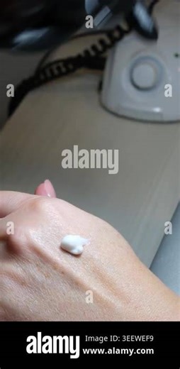 Technician in black gloves rubs nourishing cream into female hands post-manicure, hydrating skin and leaving hands soft and smooth in salon Stock Video Footage - Alamy