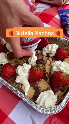 nutella nachos are the PERFECT picnic dessert and it needs no prep 😍 you need: 1 pack waffle cones 1 jar nutella 1 punnet strawberries 1 can whipped cream 1 pack honeycomb 1 pack crushed nuts crush the waffle cones in large chunks to make dessert corn chips, then load them with the rest of the dessert toppings. #picnicdate #easydesserts #buzzfeedoz #tastyoz