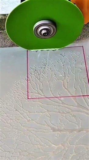 Cutting a square hole in a patterned tile and trimming its edge using a green circular diamond blade
