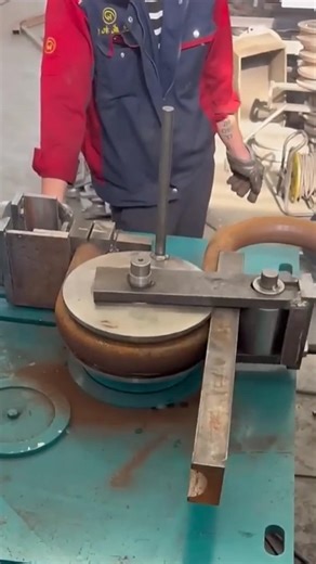 Bending an Iron Pipe with Industrial Precision.