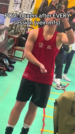 Boxers Flexing Muscles in Gym Mirrors