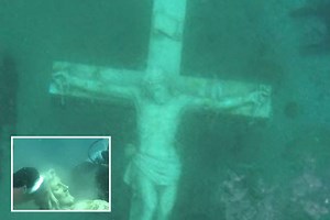 Crowds flock to giant 11ft underwater Jesus statue at bottom of lake