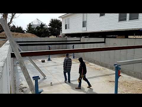 Double wide mobile home rolled over in one piece on a 9ft basement