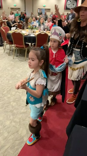 At the President’s Award Banquet, the Tlingit Culture Language and Literacy Dance Group performs the Shee Daa Kaa (Coho Entrance Song) for Grandma Florence Marks Sheakley who is a mentor to these young language learners. | Tlingit & Haida