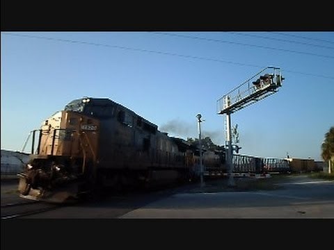 CSX Long Mixed Freight Train Screams Along Curve