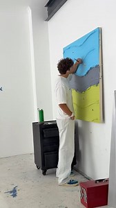 Acrylic painting featuring bold, textured bands of color in sky blue, slate gray, and lime green—each layered like gentle hills. Tiny hand-painted figures add whimsical life to the scene, creating a playful narrative within a minimalist landscape. The brushstrokes are thick, sculptural, and delightfully tactile. Painting by @werner_bronkhorst #AcrylicArt #TexturedPainting #MinimalistArt #WhimsicalScenes #ColorFieldArt #ContemporaryPainting #ModernAcrylics #StoryInSimplicity | Acrylic Masters