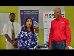 Corporate Hands | Hardware & Lumber presents UWI with US$3,000 worth of computing equipment