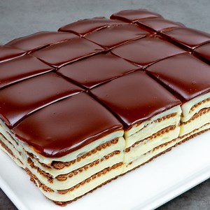 4M views · 21K reactions | The taste of childhood in one bite! The most delicious dessert without oven Ingredients: instant coffee: 4 g (0.1 oz) boiled water: 250 ml (8.5 fl oz) The cream: cocoa biscuits: 400 g (14 oz) flour: 70 g (2.5 oz) starch: 70 g (2.5 oz) eggs: 1 pc sugar: 200 g (7.1 oz) milk: 1.4 l (47 pt) vanilla flavored cream mix: 50 g (1.8 oz) The glaze: whipping cream: 300 ml (10 fl oz) dark chocolate: 200 g (7.1 oz) | Cookrate | Facebook