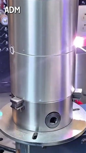 Metallic cylinder component mounted on circular base plate