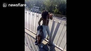 Lady gets stuck in a fence Via Newsflare | WHAT WE SEEE