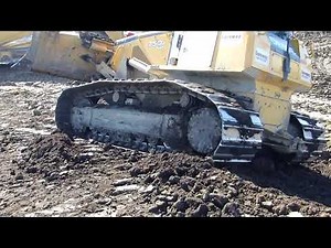 Bulldozer shaping berm