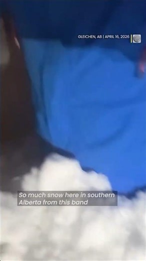 Man wades through waist-deep snowdrift in Alberta after a spring storm | #springsnow