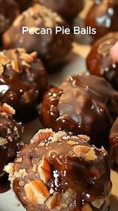 Pecan Pie Balls Ingredients * 1 cup graham cracker crumbs * 2 ½ cups pecan halves, finely chopped * 1 cup brown sugar * 1 tsp vanilla extract * 6 to 8 tbsp melted butter * ½ cup pure maple syrup * 24 ounces chocolate almond bark Instructions FIRST STEP: In a large mixing bowl, combine the graham crackers, brown sugar, maple syrup and the chopped pecans. Add only enough of the melted butter so the mix comes together and can be rolled into a ball without falling apart SECOND STEP: Shape the mix in