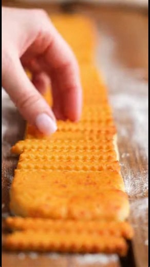 Classic Southern Cheese Straws Ingredients Serves 14 8 ounces (227 g) extra sharp cheddar cheese, finely shredded (2 cups shredded) 1/2 cup (113 g) cold unsalted butter, cubed 2 cups all-purpose flour (9 ounces; 255 g), plus more for shaping 1/4 teaspoon baking powder 1/2 teaspoon cayenne pepper 1/2 teaspoon garlic powder 1 teaspoon Diamond Crystal kosher salt; for table salt, use half as much by volume 1/4 cup (60 ml) cold water #ClassicSouthern #CheeseStraws #SouthernCooking #ComfortFood #Snac