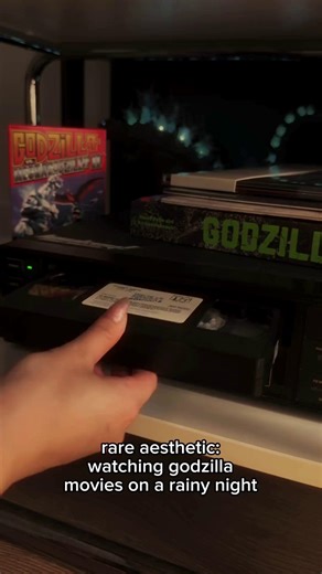 GODZILLA.OFFICIAL on Instagram: "Rain outside, the hum of a VHS, a warm CRT glow… nostalgia at its finest. 🌌"
