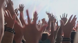 clip-1038459485-happy-people-watching-amazing-musical-concert-fans