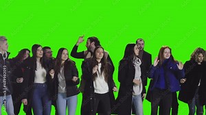 Cheerful crowd of fans dancing and enjoying at night club on greenscreen Stock Video