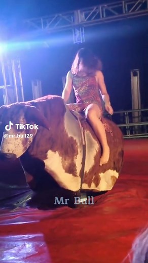 Beautiful Girl Riding the Bull